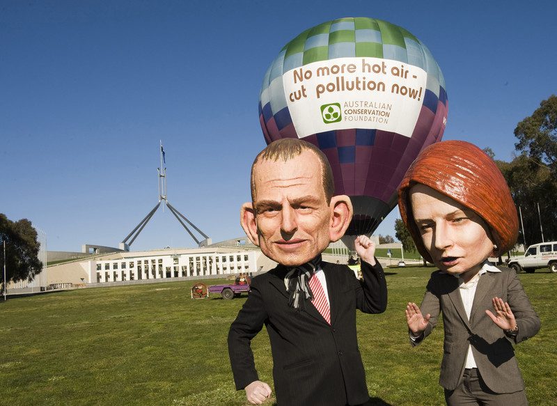 Caricature 'big heads' of Prime Minister Julia Gillard and Coalition leader Tony Abbott help launch a hot air balloon in front of Parliament House in a joint initiative by Oxfam Australia and Australian Conservation Foundation (ACF) to send a message that Australians want to see less pre election hot air and more commitment to clean energy.