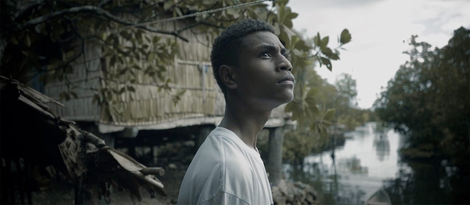 The film's protagonist looks to the sky as a cyclone rumbles in the distance.