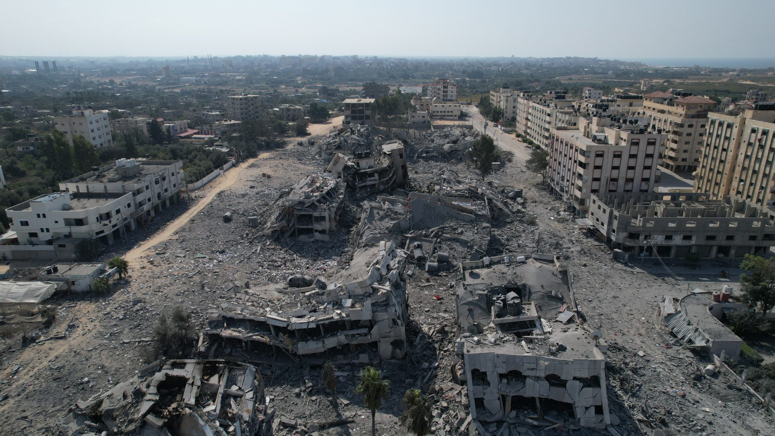 Gaza, Palestinian Territory, Occupied: The Israeli airstrikes destroyed Al Zahra City. Residential towers in the Gaza Strip were turned into rubble during an Israeli airstrike, with at least twenty-five residential towers being targeted. Photo: Alef Multimedia Company/ Oxfam