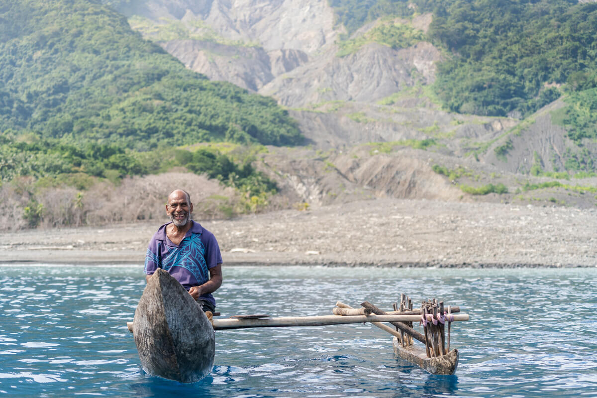 Vanuatu: Roy fishes off the coast of his home, Molpoe village in Vanuatu. In 2022, Molpoe was hit by a devastating landslide caused by torrential rain, which has become more frequent due to extreme weather. The landslide destroyed many homes and plantations that the people relied on for their livelihoods. Photo: Ivan Utahenua/Oxfam