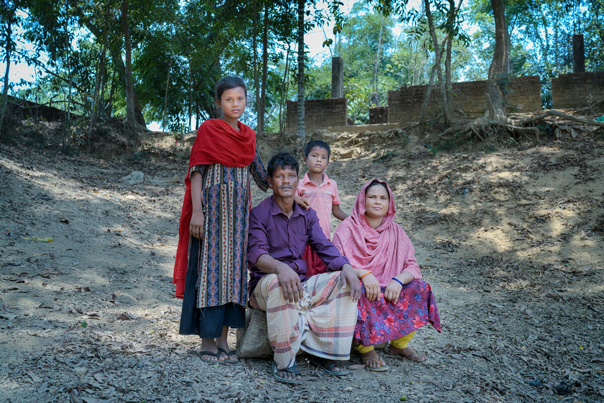 Bangladesh: Jannat with her family. Jannat lives in Nayapara, in the Cox's Bazar area which hosts over 1.7 million Rohingya refugees. Her community was severely impacted by water scarcity until Oxfam partner organisation NGO Forum installed a Mini Piped Water Distribution Network, enabling community members to access safe, clean water whenever they need. Photo: Fabeha Monir/Oxfam